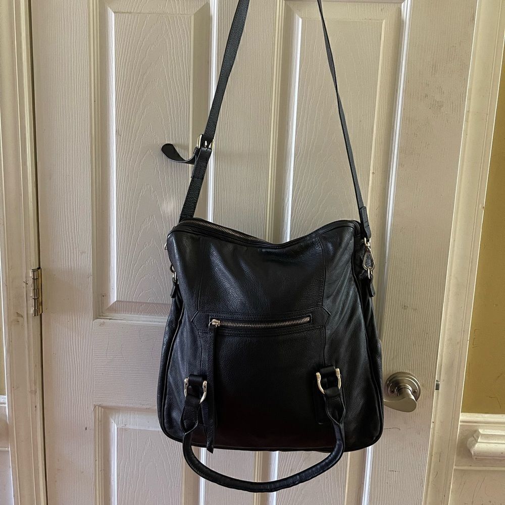 Massi black leather large fold over shoulder bag with silver tone hardwares .